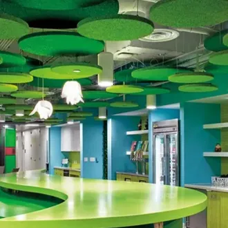 green circular ceiling panels in a bright colored room